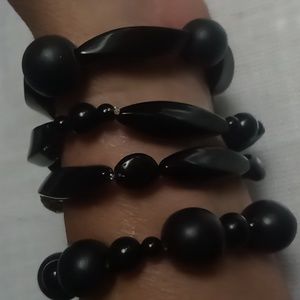 4 black on black expandable bracelets